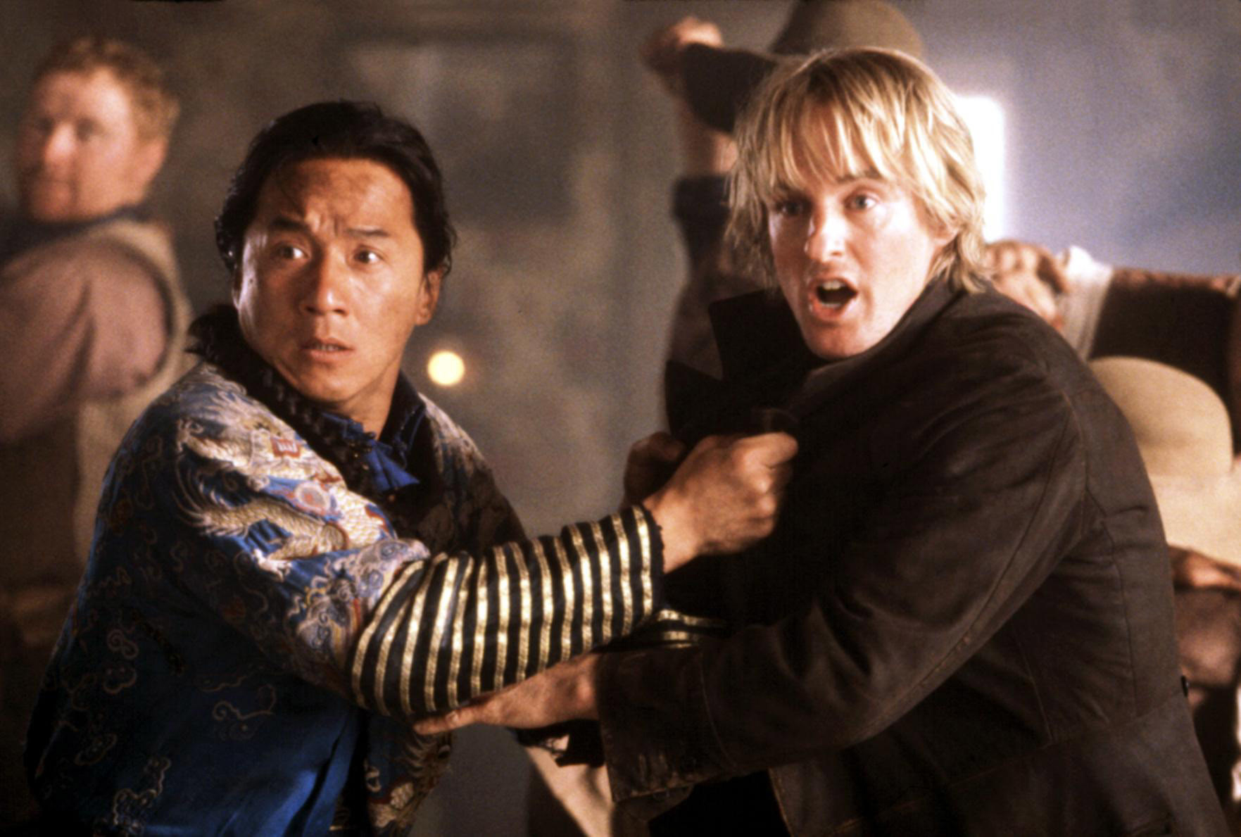Jackie Chan and Owen Wilson grabbing each other