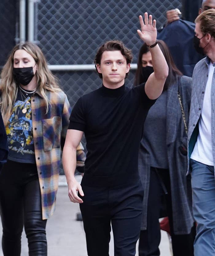 Holland waves his hand