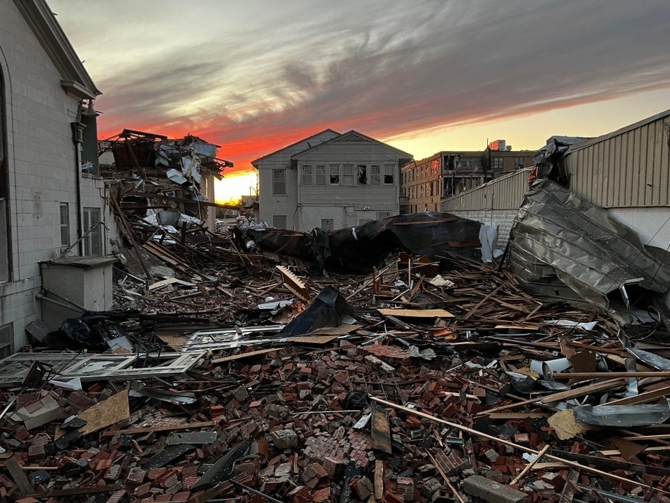 Rubble from a destroyed home covers the ground 