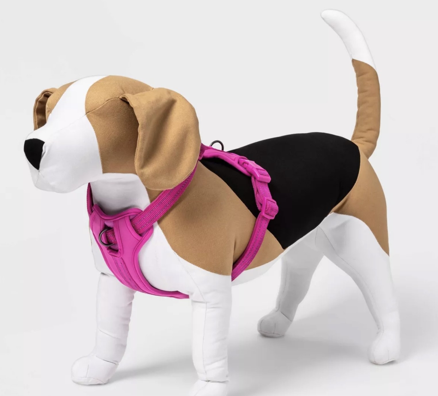 a dog toy wearing the harness in pink