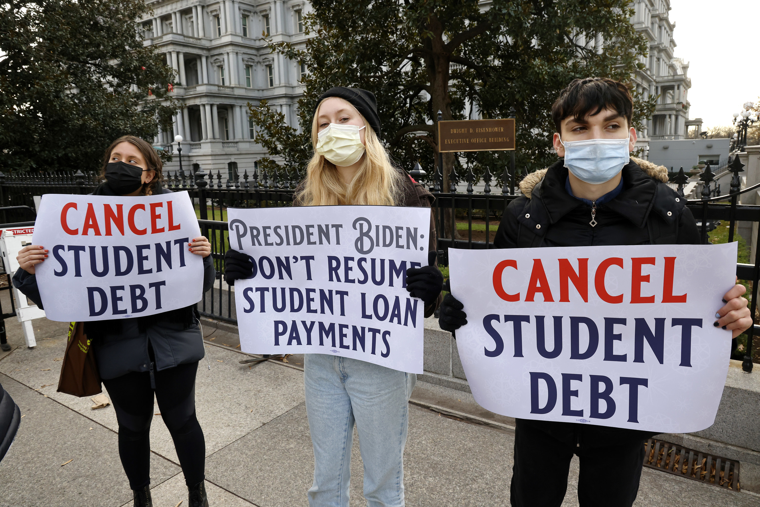 Protesters near the White House with cancel student debt signs
