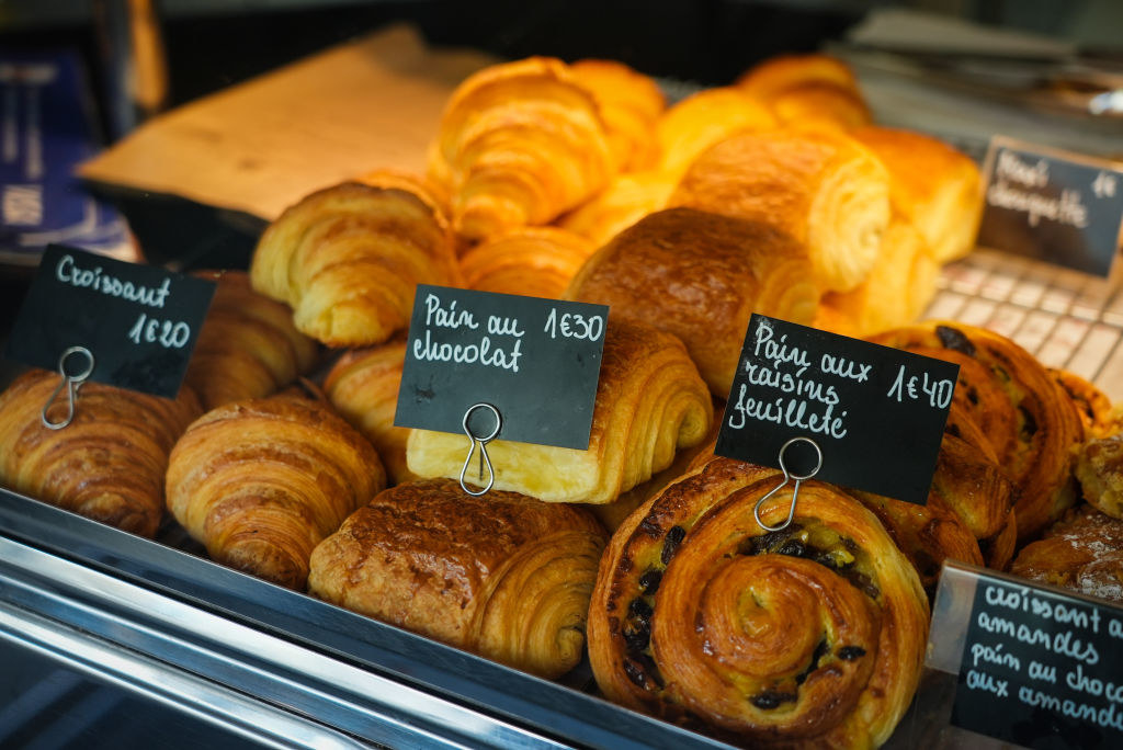 A display of French bread, including pain au chocolat and croissant
