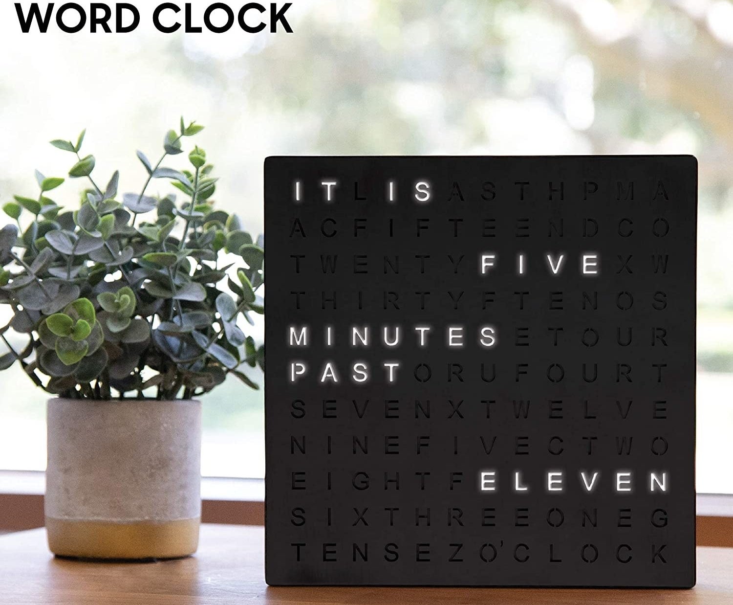 Word clock reading &quot;it is five minutes past eleven)