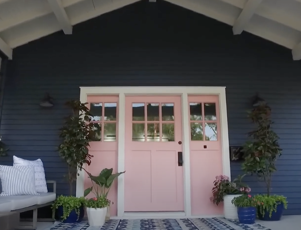 Light pink front door outside a home