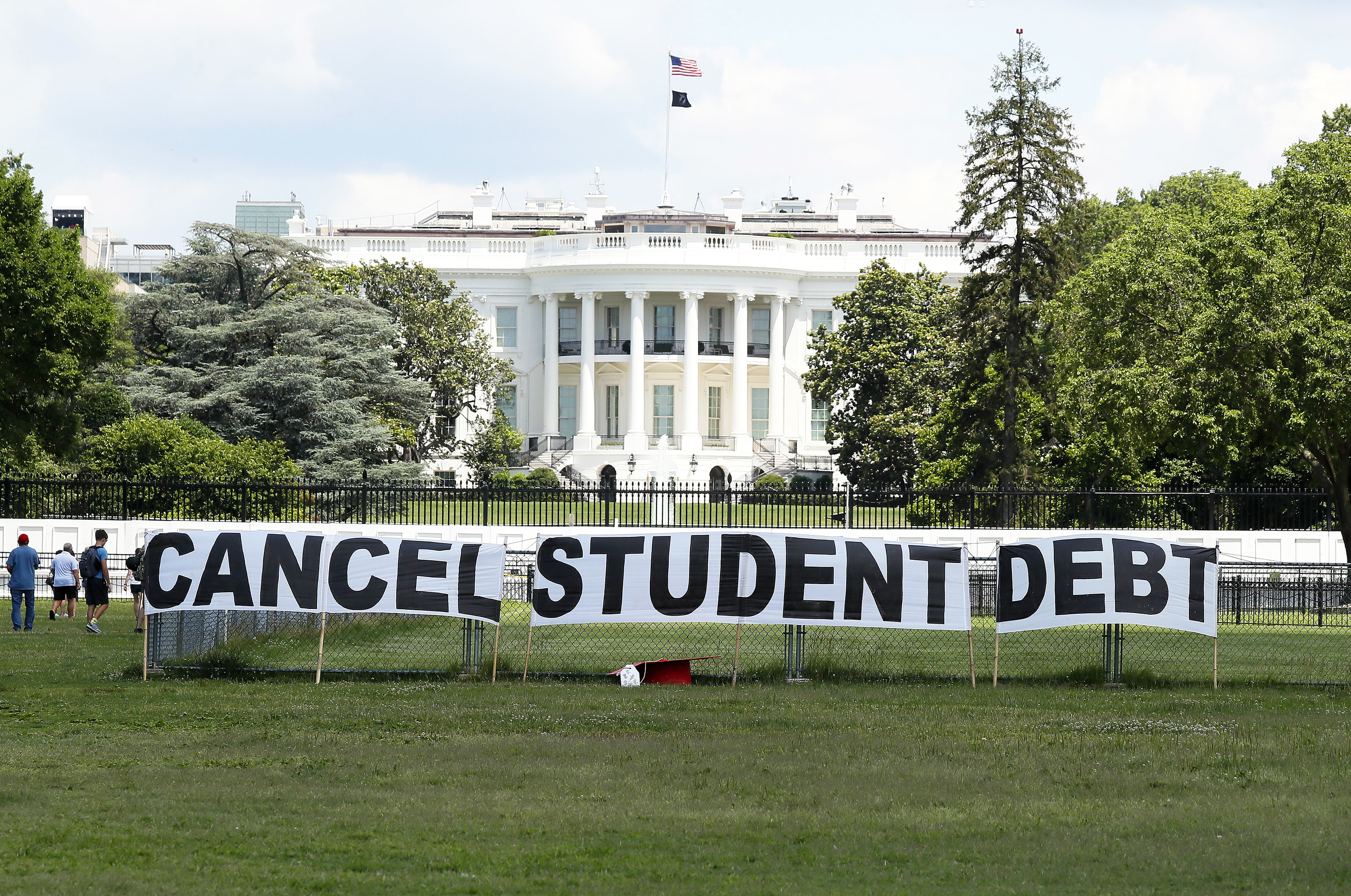 Cancel student debt protest signs outside the White House