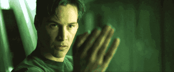 GIF of Keanu as Neo motioning to come forward