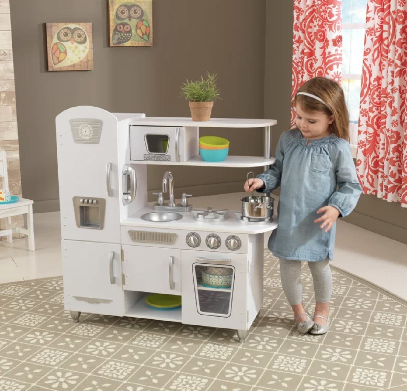 Kid in play kitchen