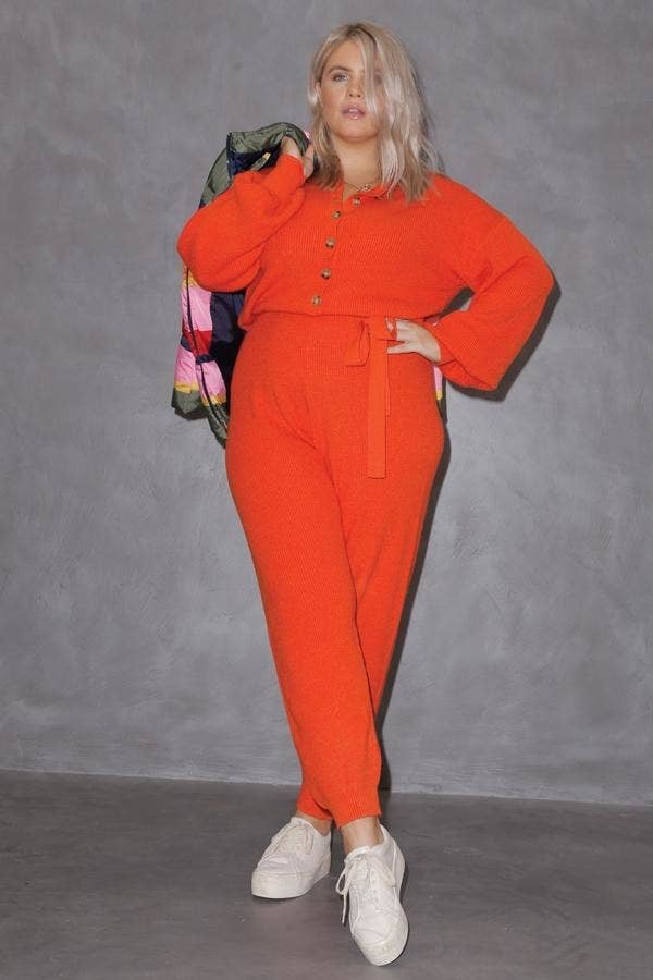 model wearing the orange jumpsuit