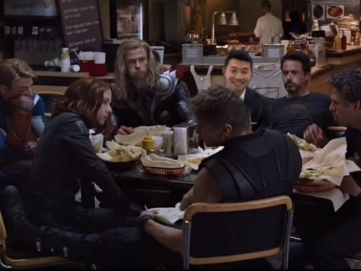 Simu Liu photoshopped into the post-credits scene of &quot;The Avengers&quot; with the maiin cast seated around a table at the diner