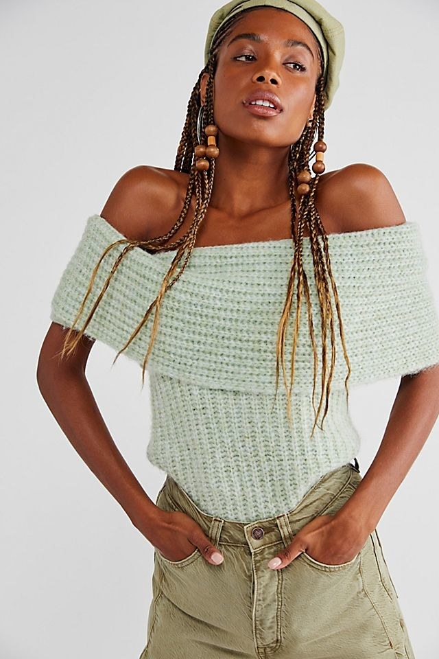 model wearing the sweater in jade green