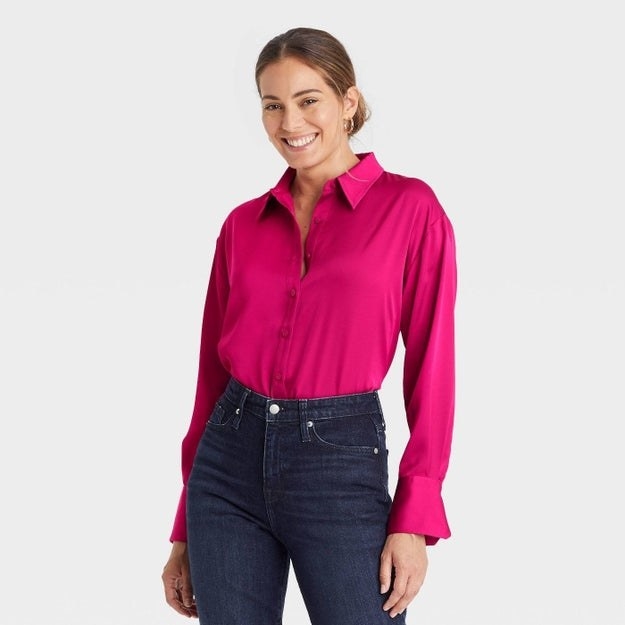 Model wearing hot pink long sleeve button down blouse