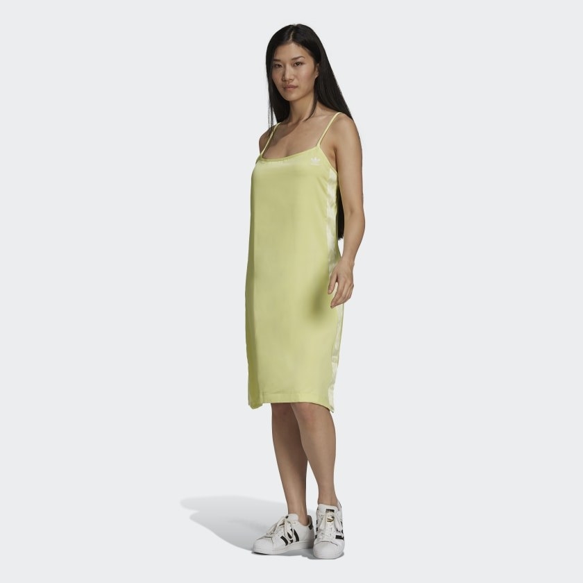 model wearing satin dress in pulse yellow