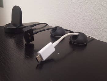 A reviewer's setup with several of the clips holding cords