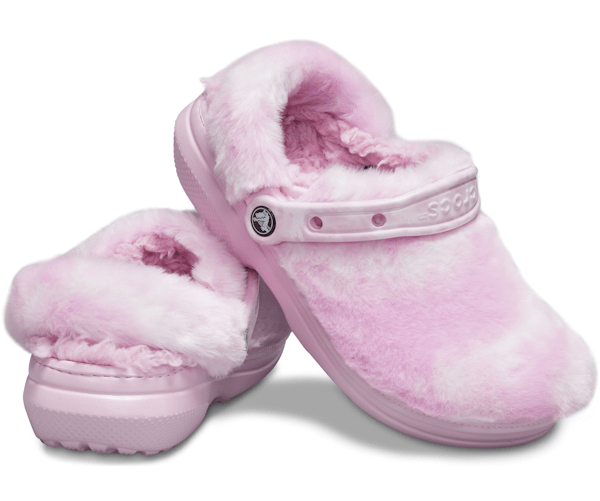 A pair of fur-lined pink and white croc clogs