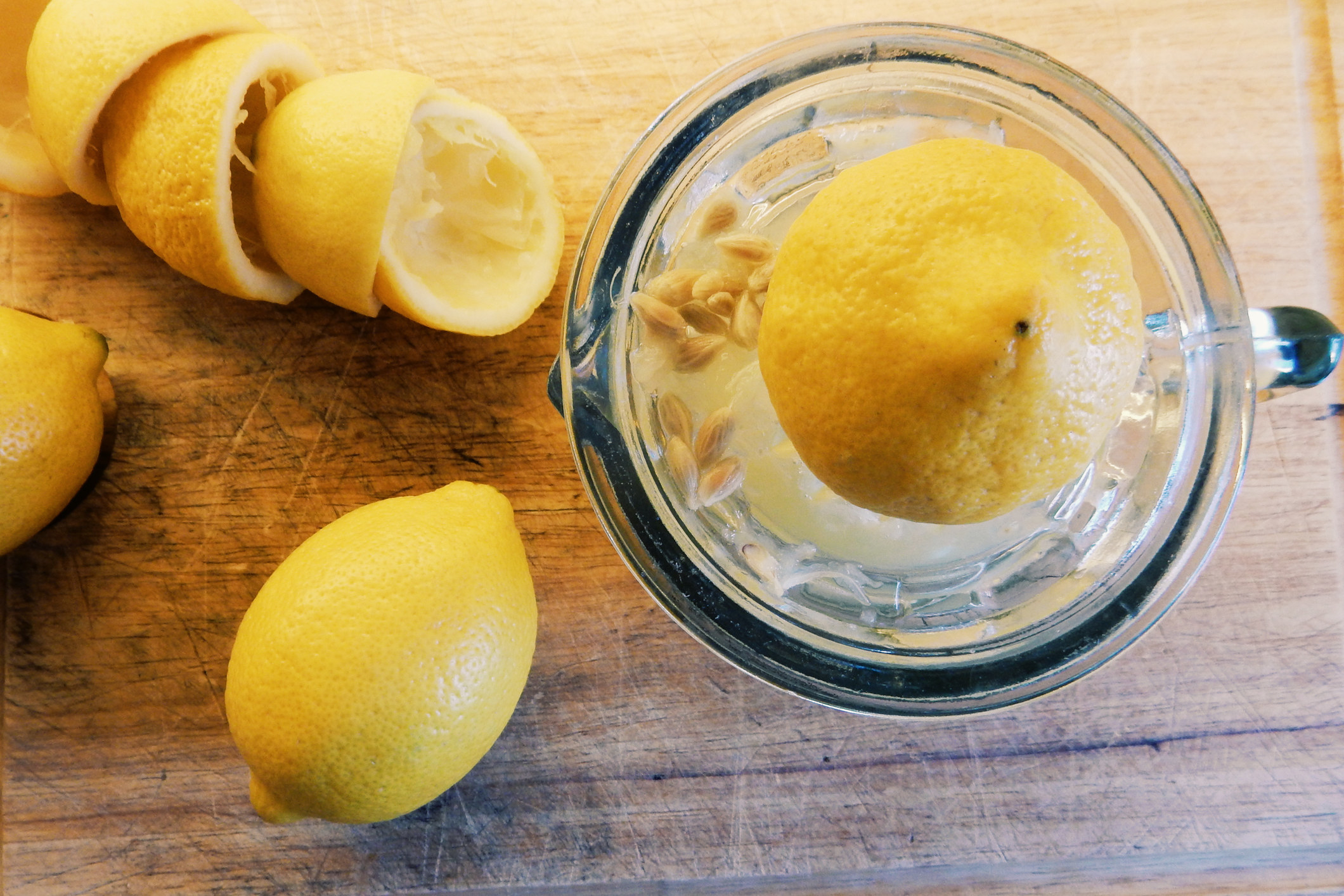 Squeezing lemons for juice.