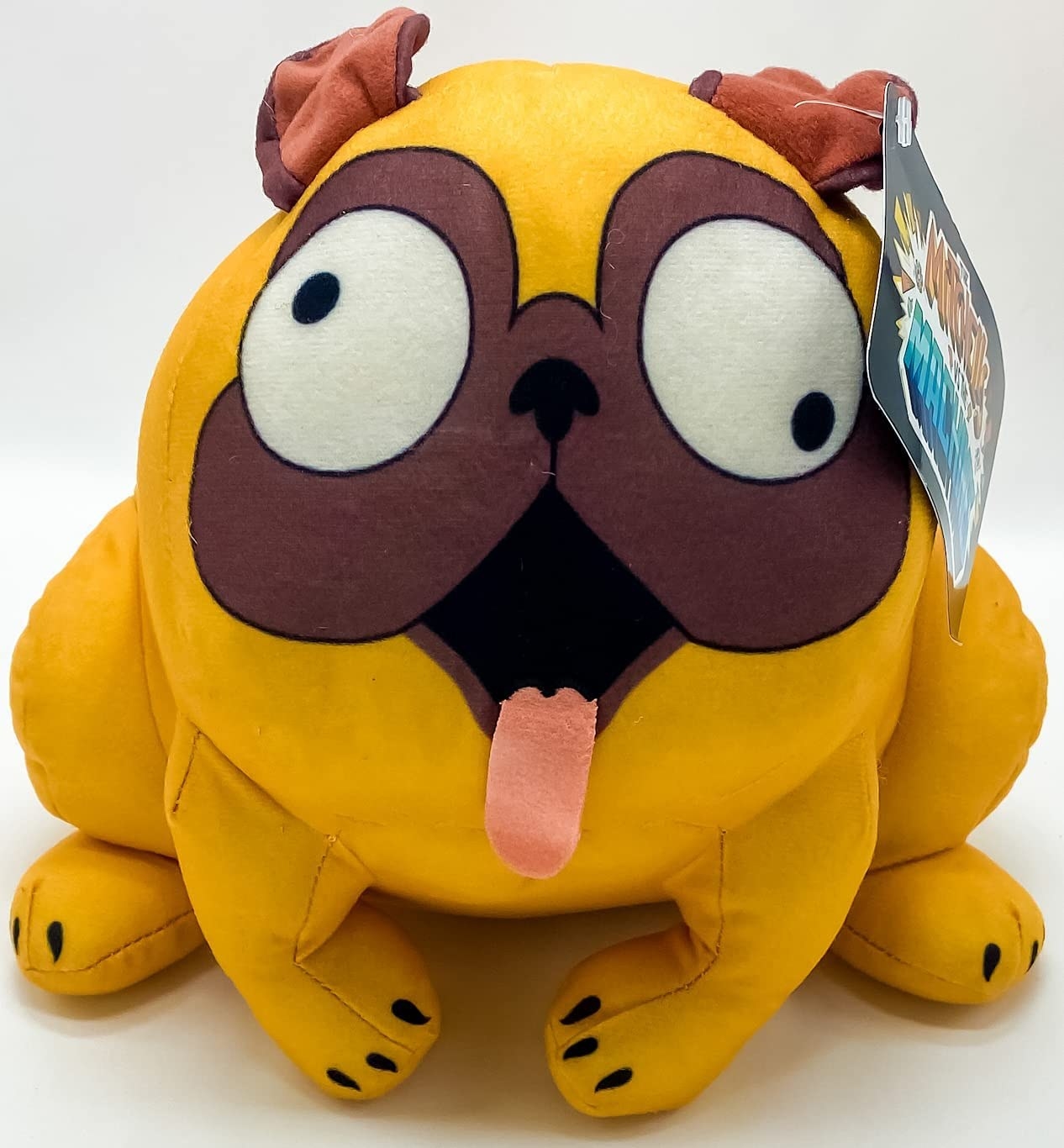A goofy looking dog stuffed animal with googly eyes and a tongue sticking out