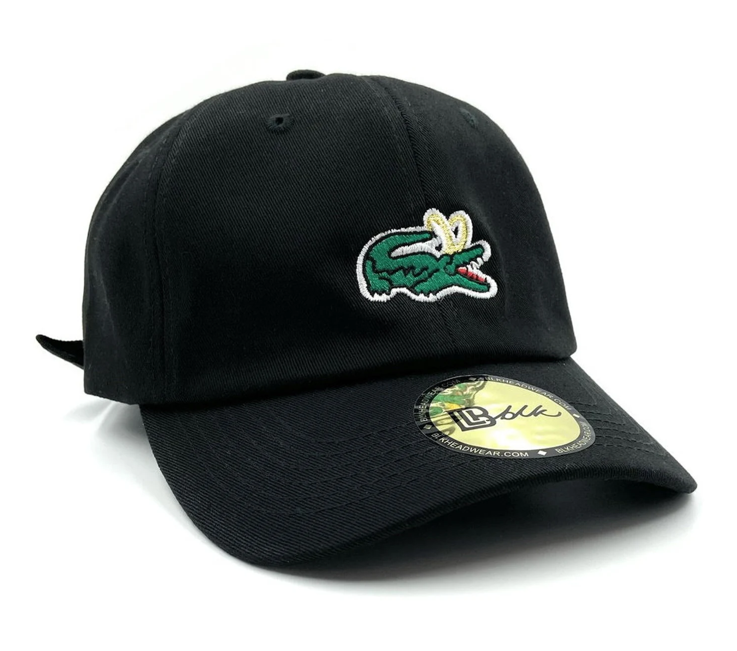 A black &quot;dad&quot; baseball cap that has a small alligator with loki&#x27;s gold horns logo on it
