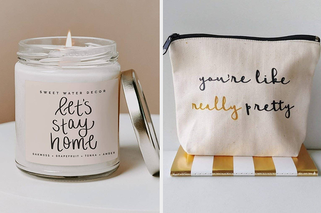 a let's stay home candle and a makeup pouch