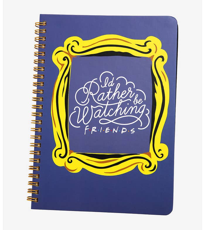 the purple spiral-bound notebook