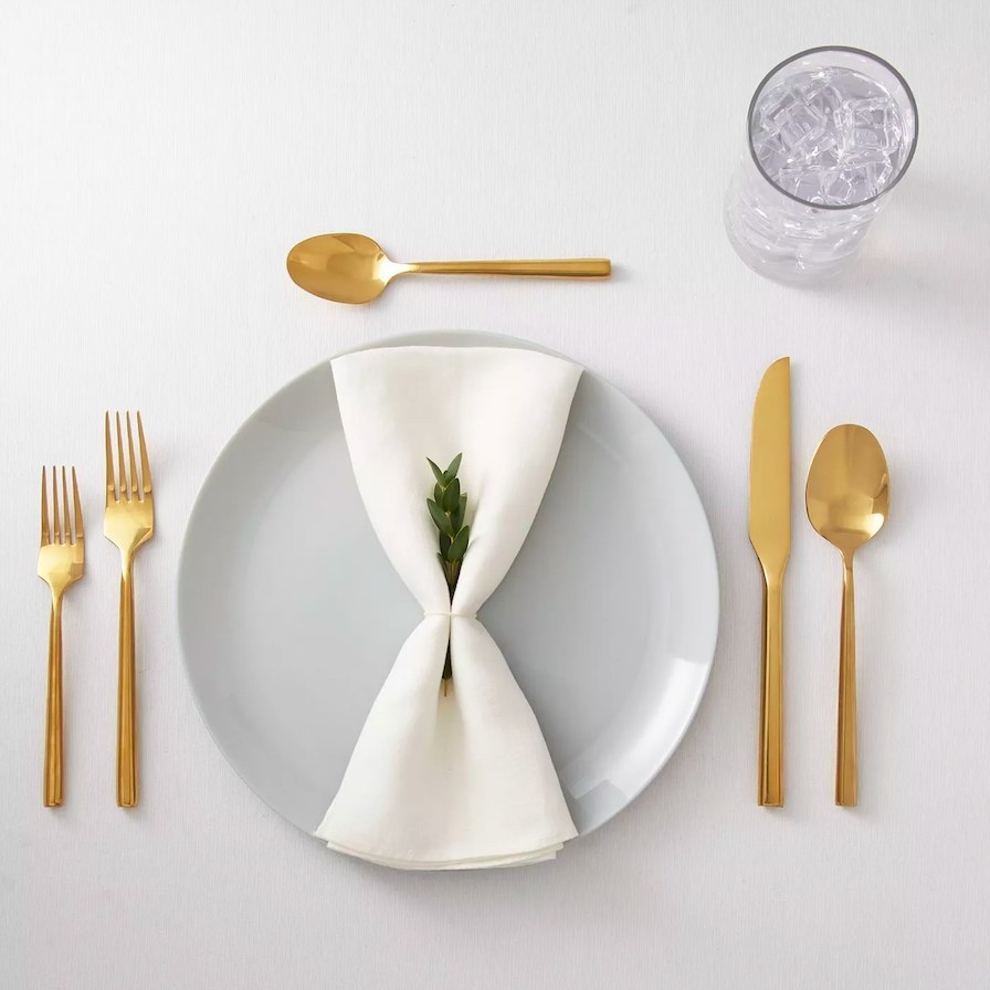 Gold silverware used in a table setting