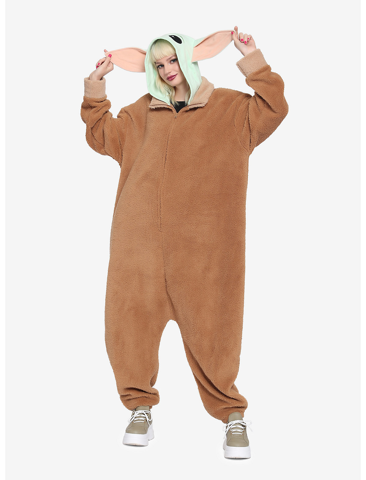 A model in the onesie with a hood that looks like baby yoda