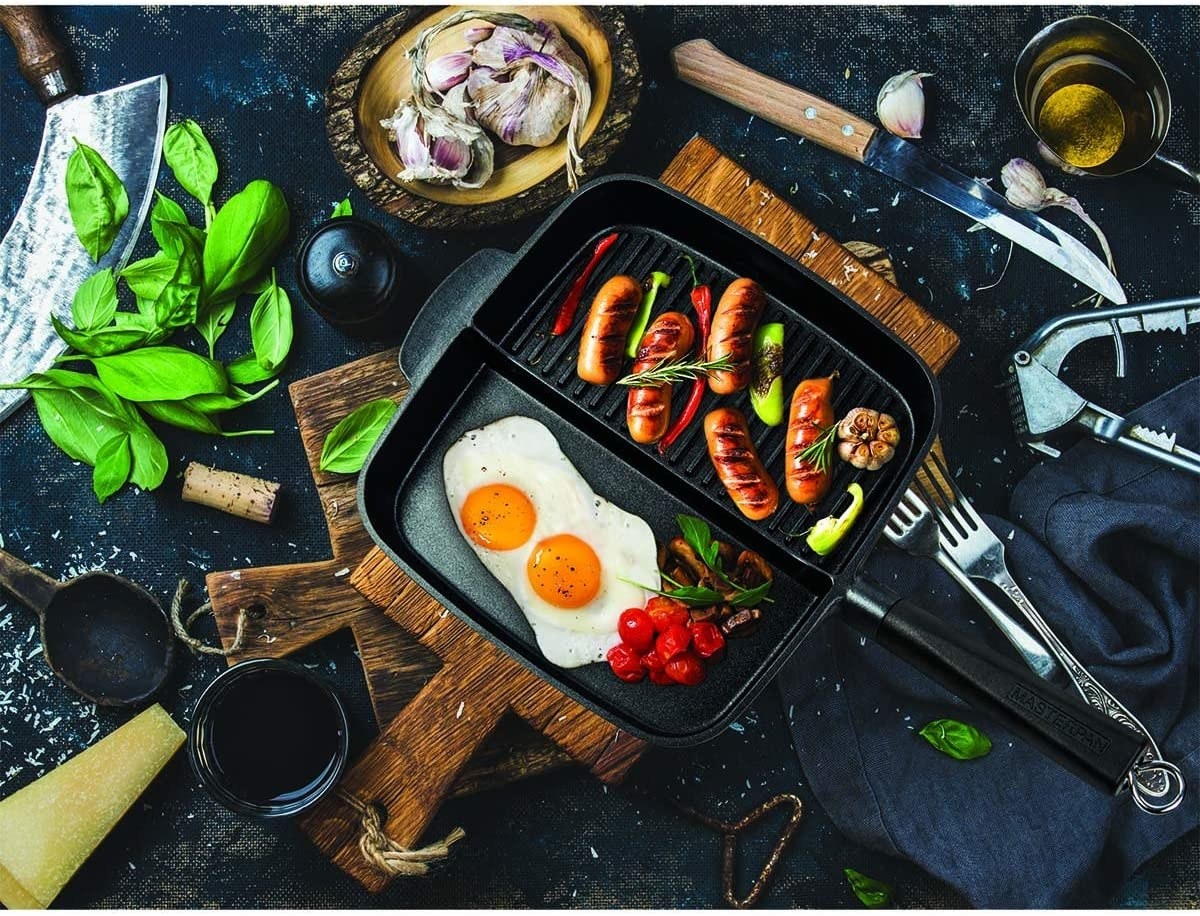 The pan with eggs and sausages in it