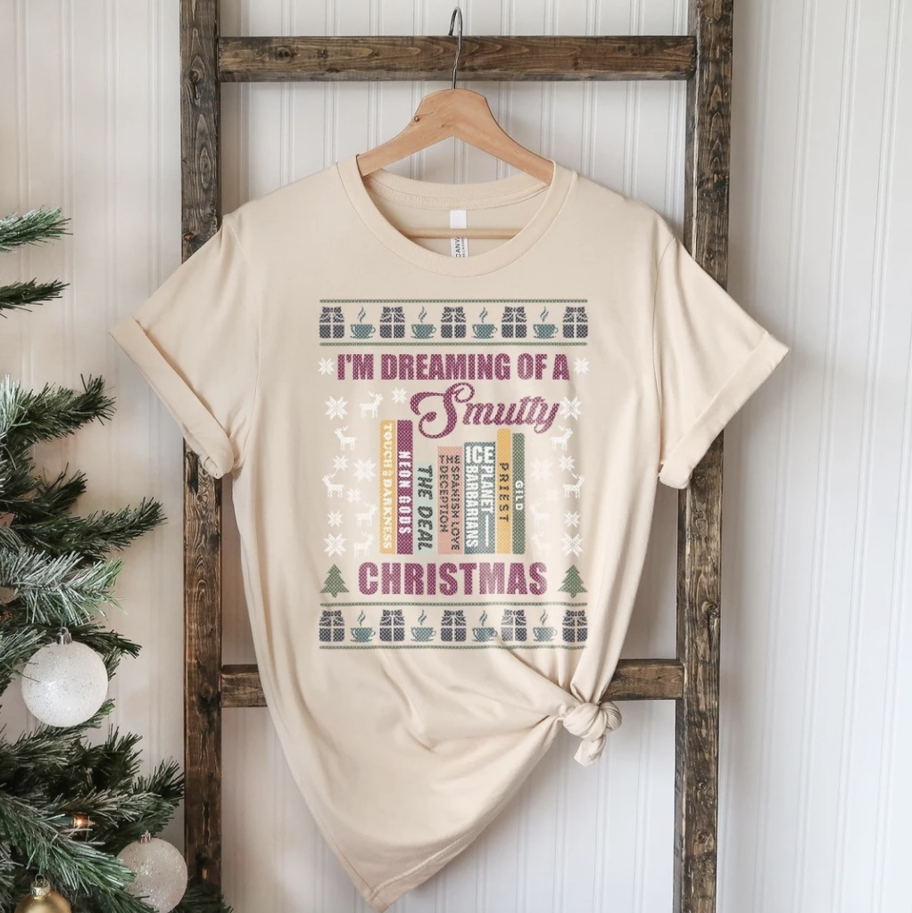 beige colored tshirt with christmas decor that reads i'm dreaming of a smutty christmas