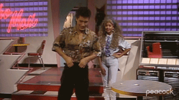 Slater from &quot;Saved by the Bell&quot; taking off his clothes to reveal a leotard.
