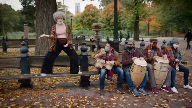 Kate McKinnon dressed as an old lady, dancing on a Central Park bench next to a group of musicians in &quot;Saturday Night Live&quot;