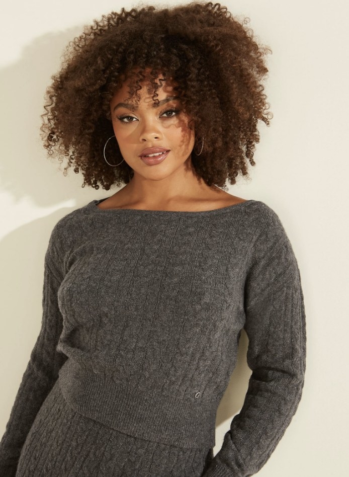 a grey cable knit sweater