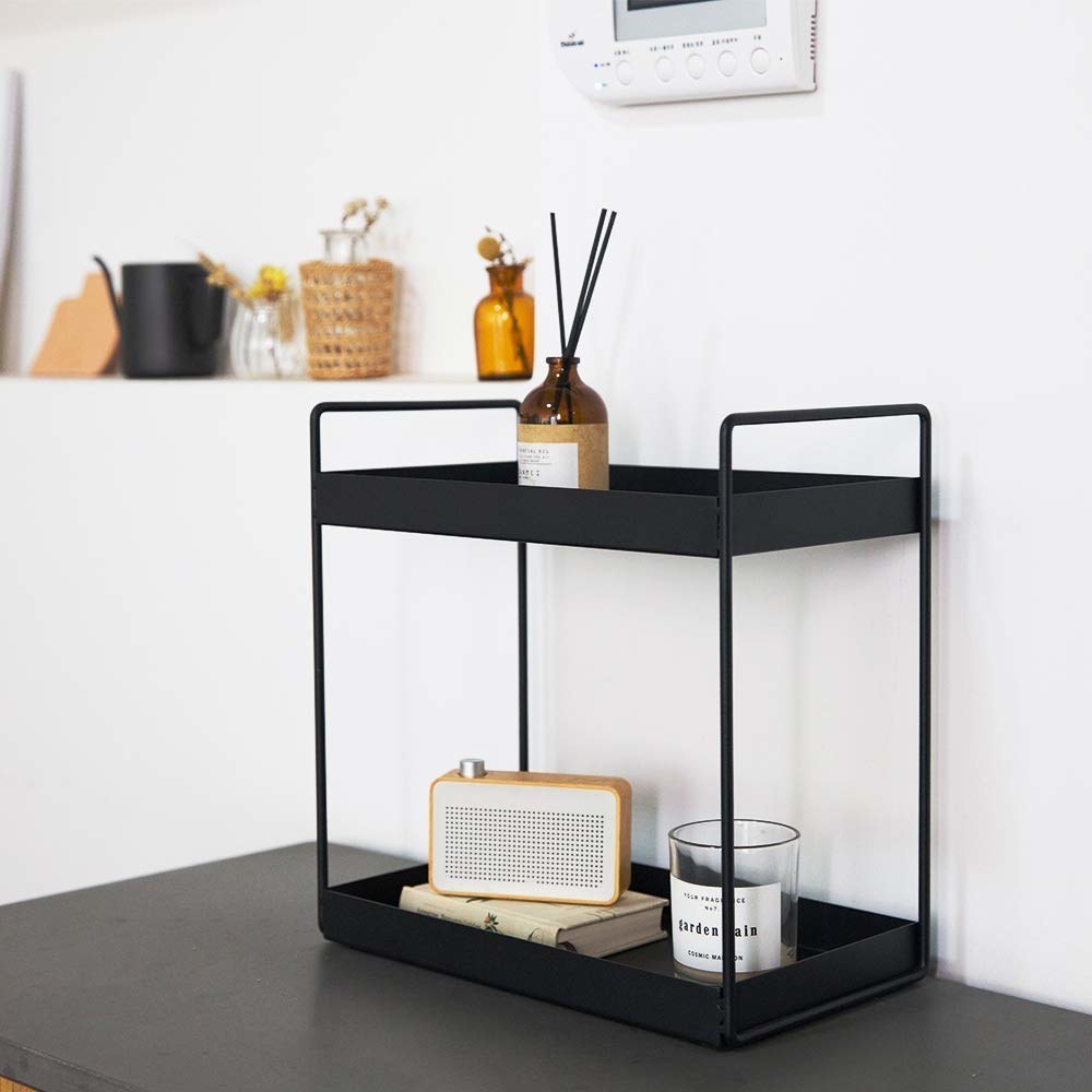 A two-tier organiser with items on it