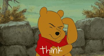 A yellow bear wearing a red top and standing in front of a brick wall, tapping his head and saying &quot;think&quot;