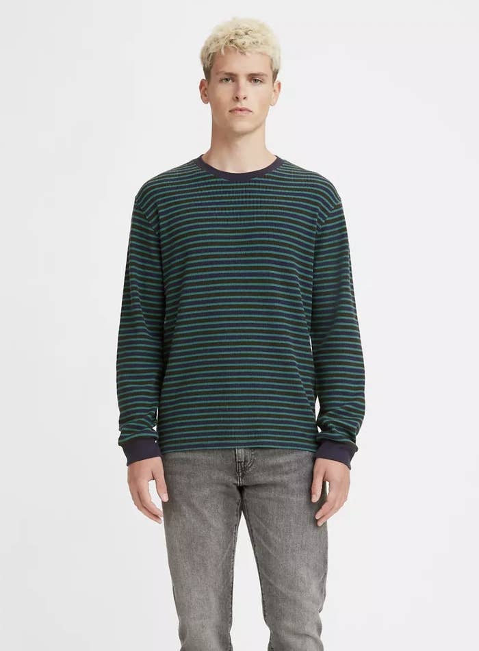 Model wearing the teal striped long-sleeve