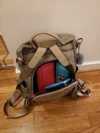 the khaki backpack open from the inside