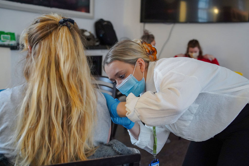 A woman getting a shot