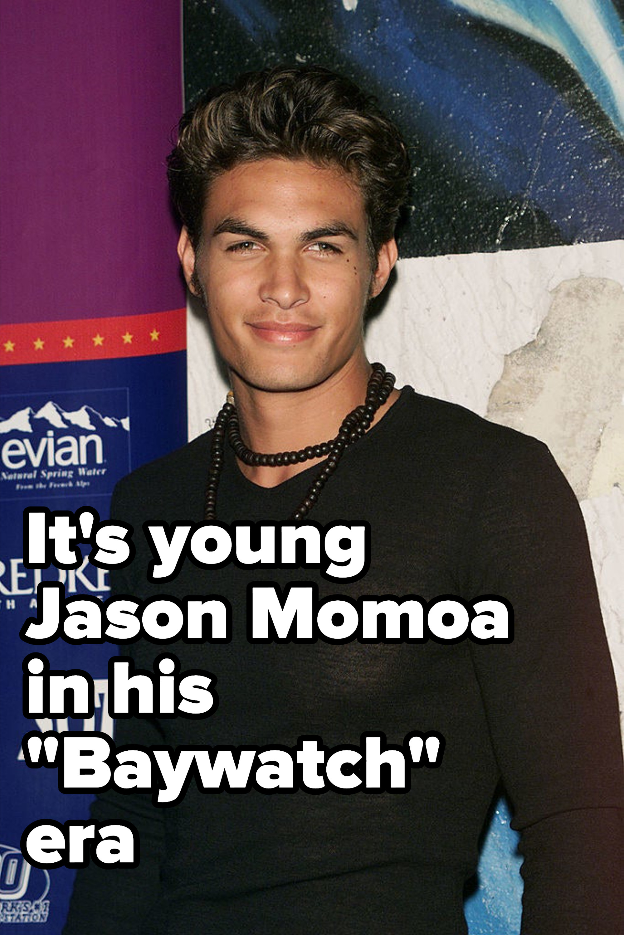 young jason momoa in a tight black shirt