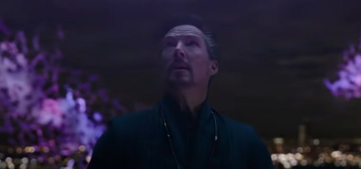 Doctor Strange looking up at purple rifts in the sky in &quot;Spider-Man: No Way Home&quot;