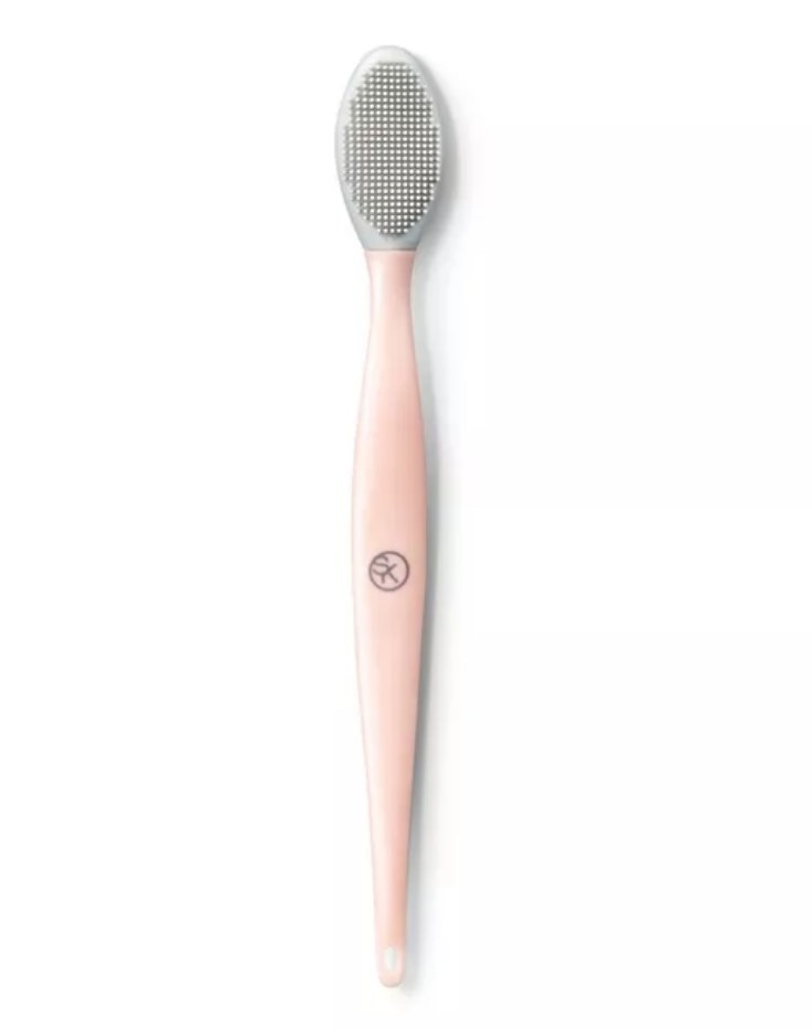 A pink lip scrubber tool