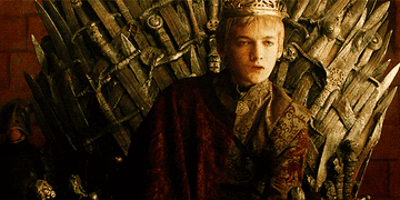 joffrey sits on the throne and looks annoying doing it