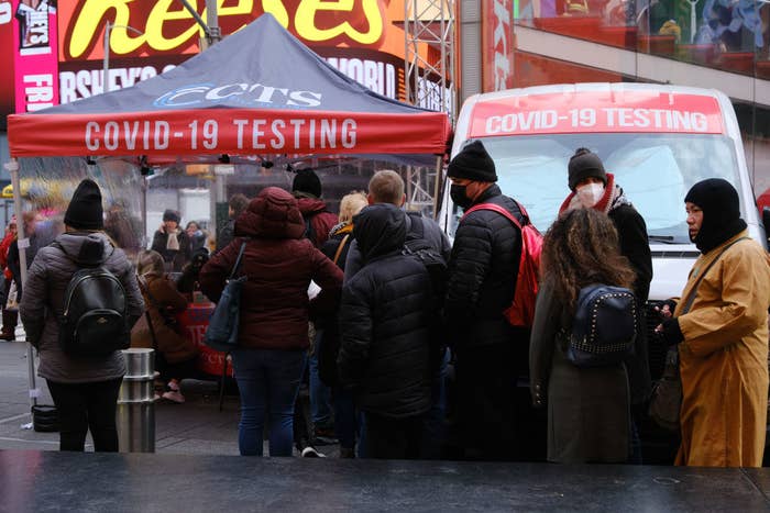 A line of people waiting outside to get tested for COVID-19