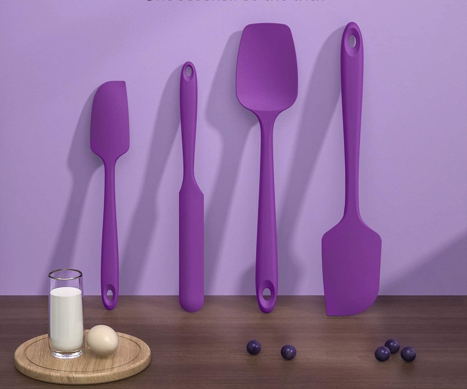 a set of vividly coloured cooking utensils
