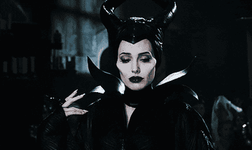 maleficent goes from looking sad to giving the most evil smile possible