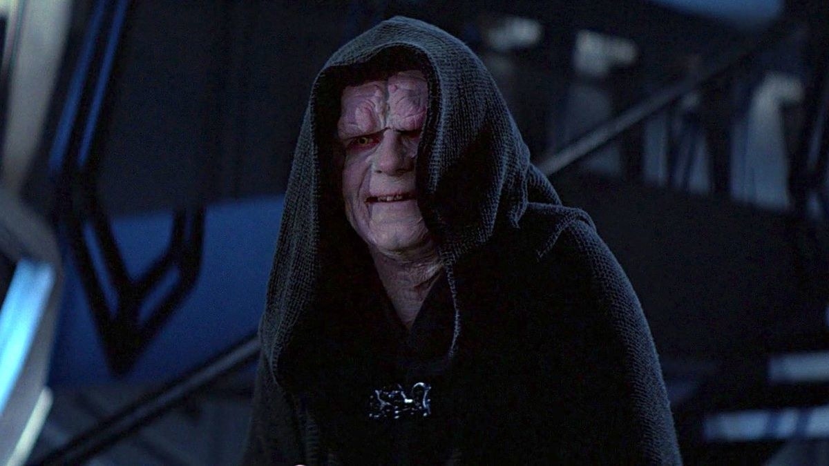 emperor palpatine stands there looking as evil as someone possibly can