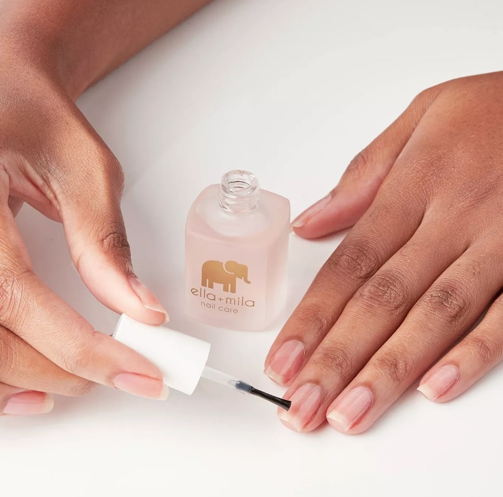 A model applying a nail care strengthener