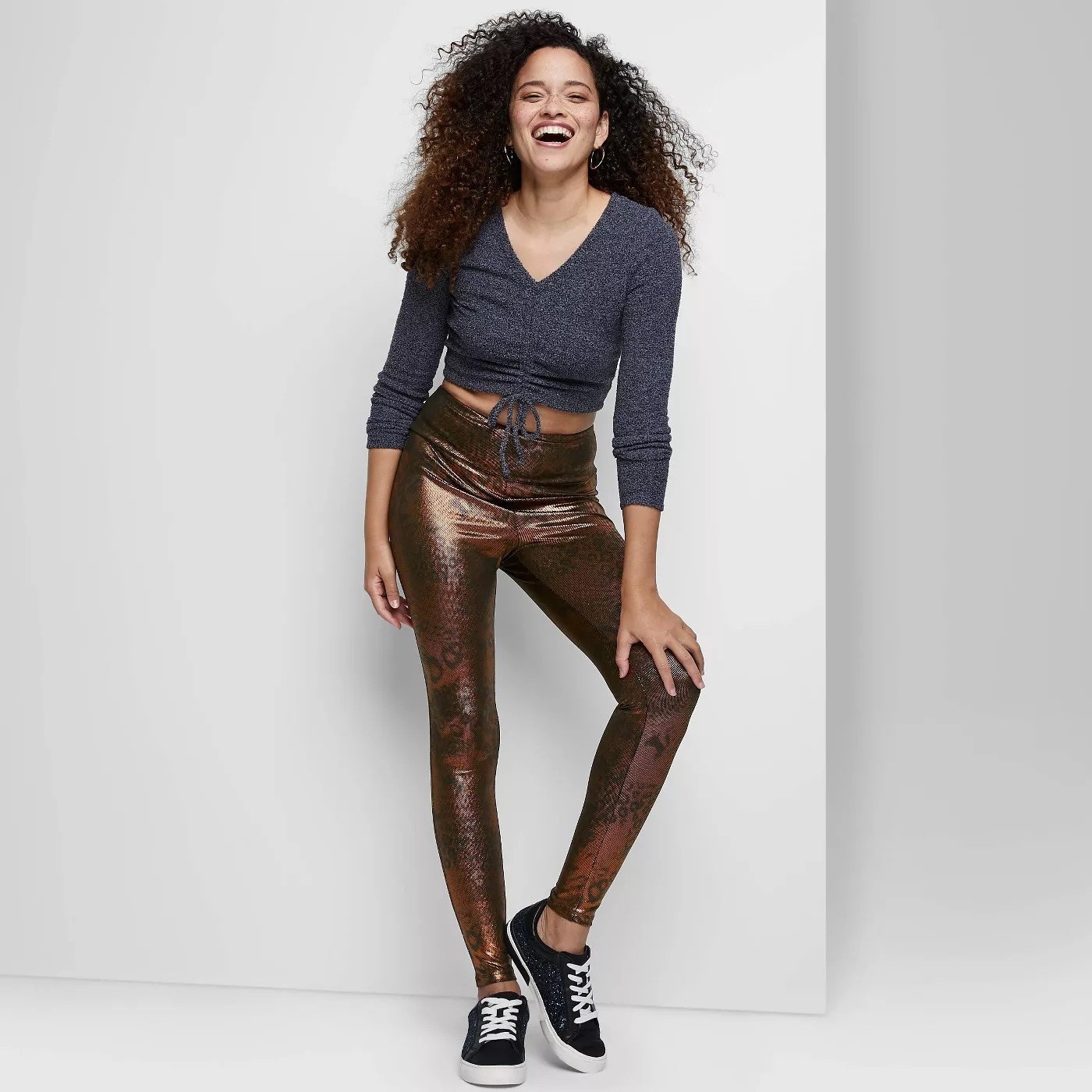 Model wearing brown leggings