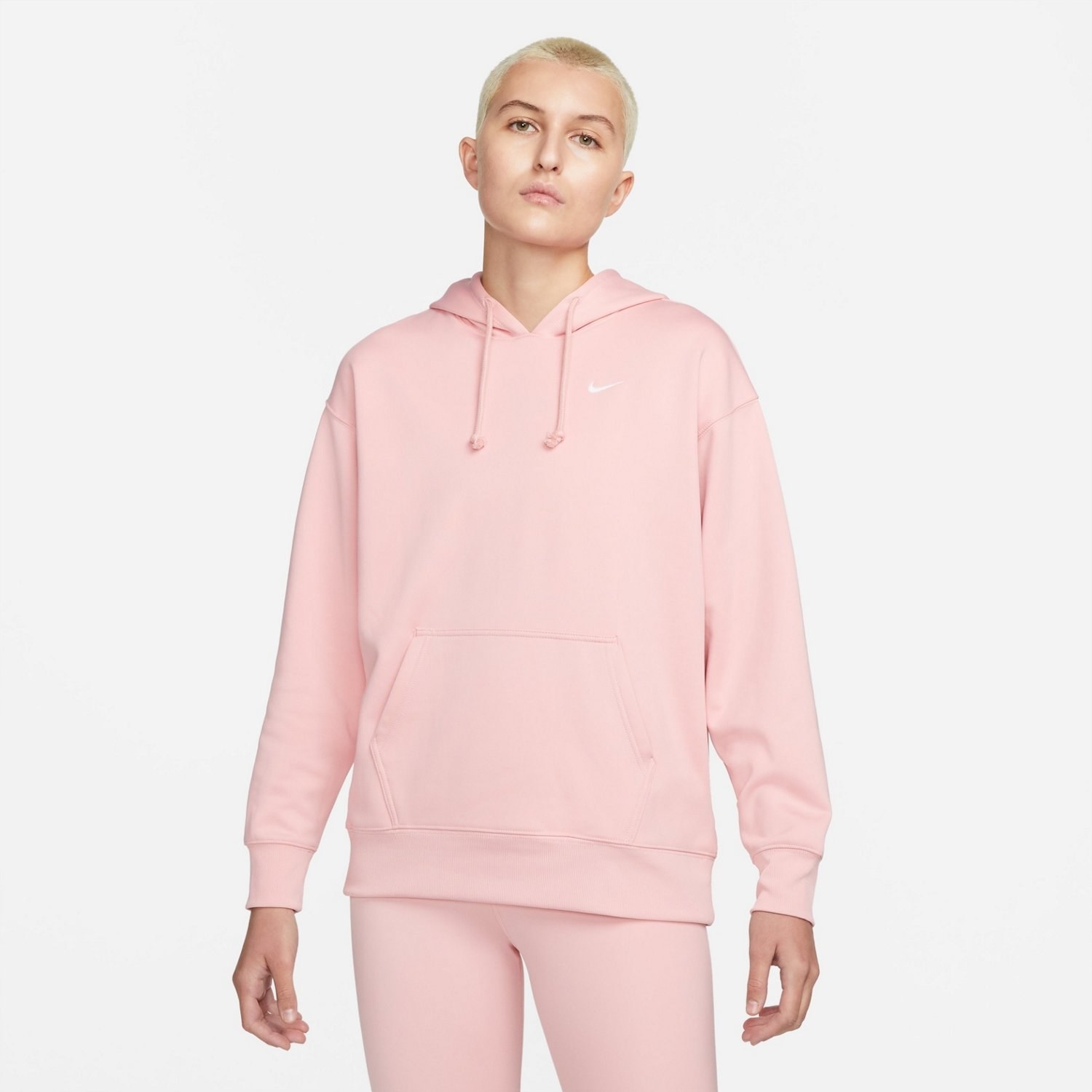 model wearing pink hoodie and pink leggings