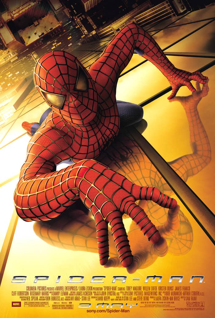 Tobey Maguire climbing a skyscraper as Spider-Man on the poster