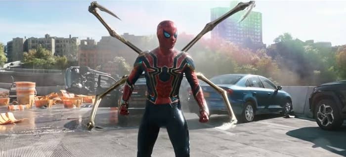 Spider-Man on a ruined highway with his Iron Spider suit on and his four robot legs out in &quot;Spider-Man: No Way Home&quot;