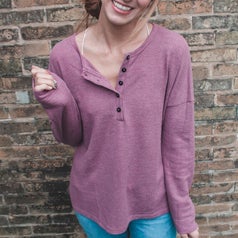 Reviewer wearing the light purple henley