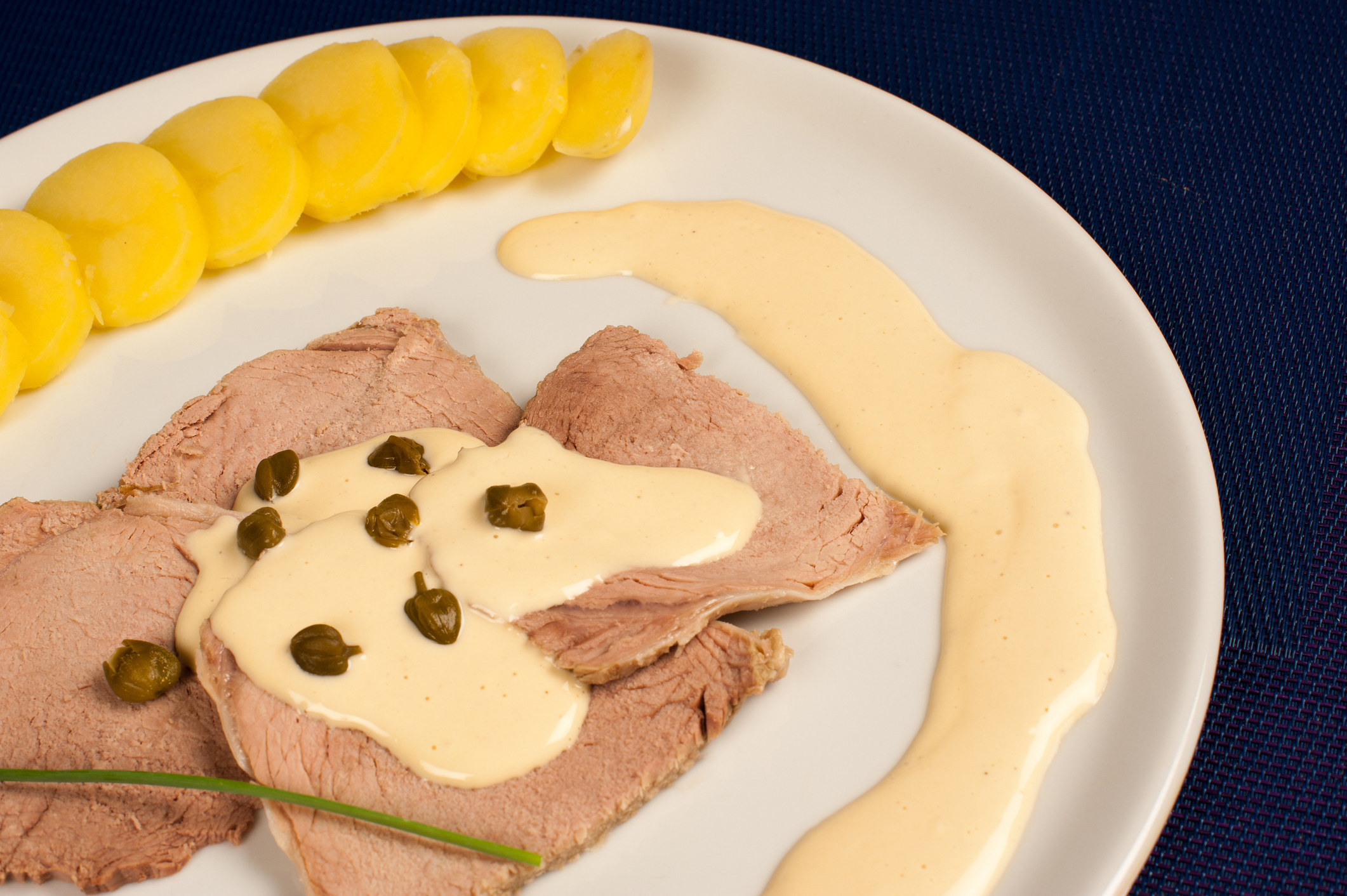 Vitel Toné — cold, sliced veal covered with a creamy, mayonnaise-like sauce that has been flavored with tuna